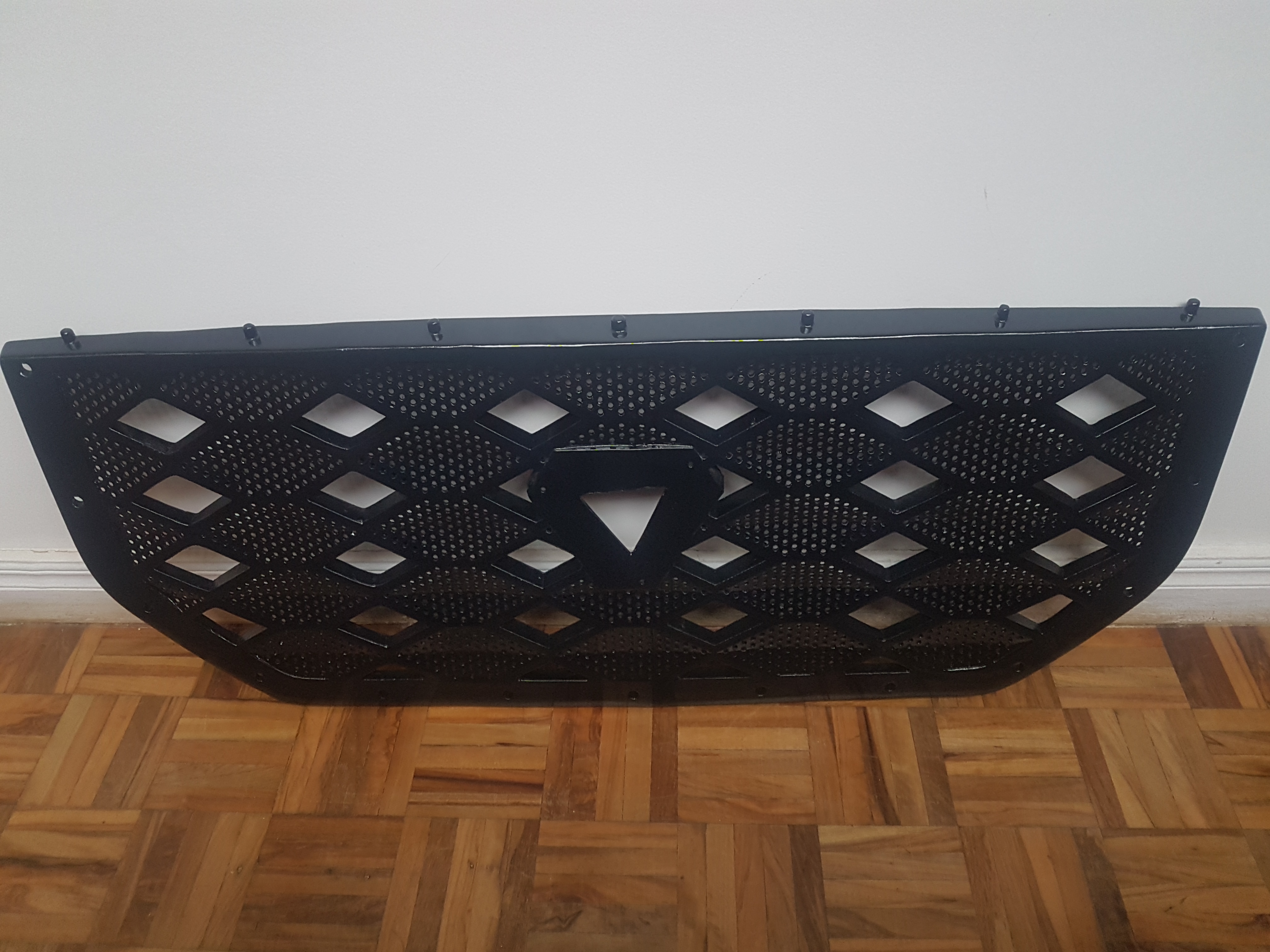 Reverse-engineered automotive grille part