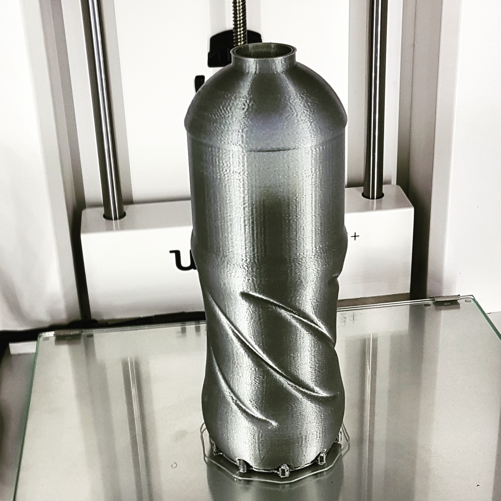 Metallic-finish printed part on the build plate